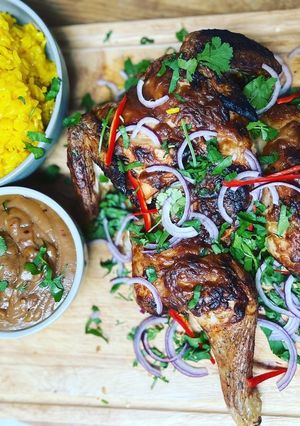 A picture of Spatchcock Satay chicken with Peanut dipping sauce and Saffron rice.