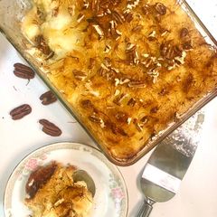 Kunafarissa (Kunafa + Harissa) with QESHTA (Thick Cream) A picture of Kunafarissa (Kunafa + Harissa) with QESHTA (Thick Cream).