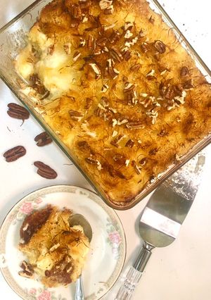 A picture of Kunafarissa (Kunafa + Harissa) with QESHTA (Thick Cream).