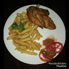 A picture of French fries with deep fried hot & tangy chicken.