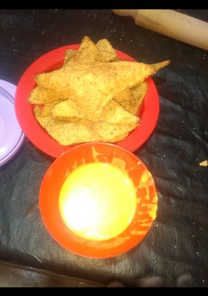 Una foto de Nachos caseros con cheddar <3