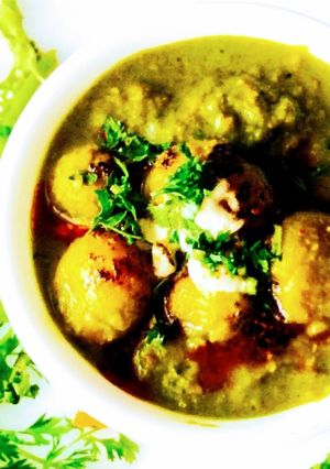 A picture of Dum aloo in Thai green curry.