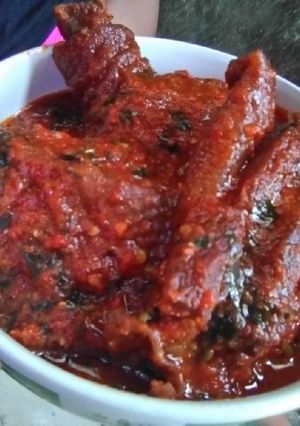 A picture of Fried Chicken with Ugu Leaves Stew.
