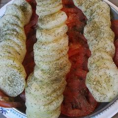 A picture of Cucumbers and Tomatoes with Herbs and Spices.