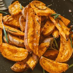 A picture of Roasted Sweet Potato Wedges with Brown Sugar Sriracha Glaze.