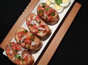 A picture of tomato salad with boiled eggs