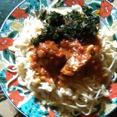 A picture of Spaghetti and macaroni with stew.