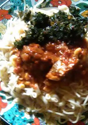 A picture of Spaghetti and macaroni with stew.
