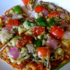 A picture of Thin Crust Roti Pizza.