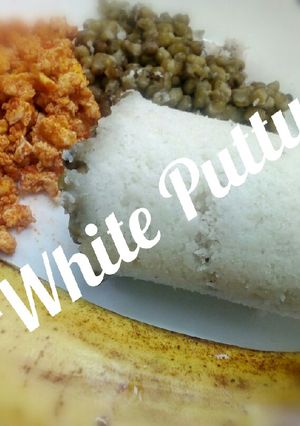 A picture of White Puttu with Green Moong Dhal and Egg accompanied Banana.