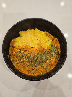 A picture of Chicken Paprikash on Polenta.