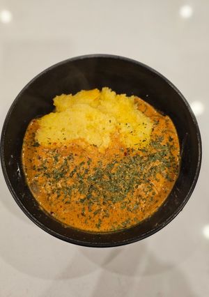 A picture of Chicken Paprikash on Polenta.