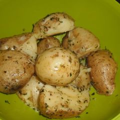 A picture of Potatoes with herbs.