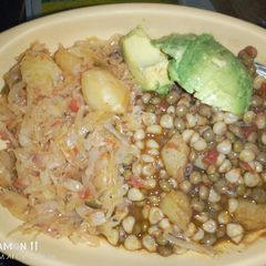A picture of Githeri and steamed cabbage plus avocado.