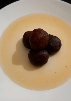 A picture of Caramelized milk and banana jamun.