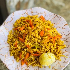 Macaroni jollof with carrots and egg A picture of Macaroni jollof with carrots and egg.