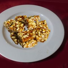 A picture of Peanut Burfi (candy) brittle? Balls?.
