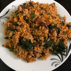 A picture of Jallof rice with vegetables.