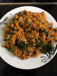 A picture of Jallof rice with vegetables.