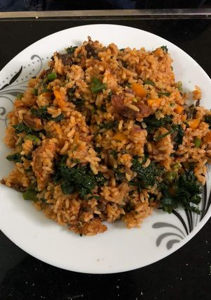 A picture of Jallof rice with vegetables.
