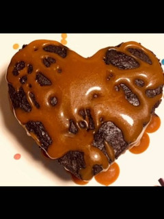 A picture of Hot Chocolate sauce with cake.