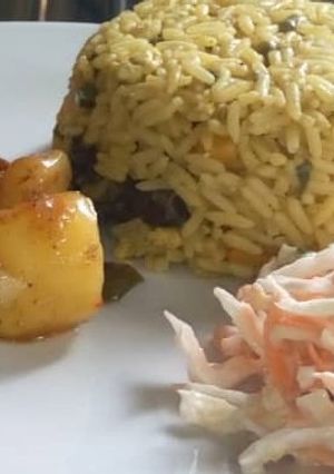 A picture of Jallof rice couslour with aresh souce.