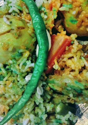 A picture of Egg Biryani with Mix Veggies.