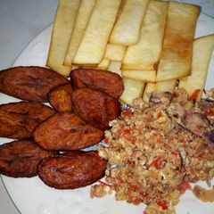 A picture of Fried Yam, Ripe Plantain with Egg and Sardine Sauce.