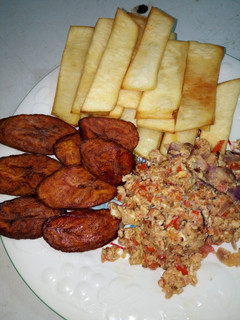 A picture of Fried Yam, Ripe Plantain with Egg and Sardine Sauce.