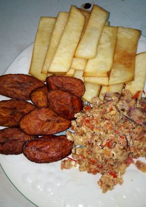 A picture of Fried Yam, Ripe Plantain with Egg and Sardine Sauce.