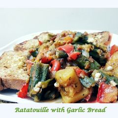 A picture of Ratatouille with Garlic Bread.