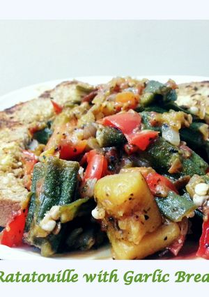 A picture of Ratatouille with Garlic Bread.