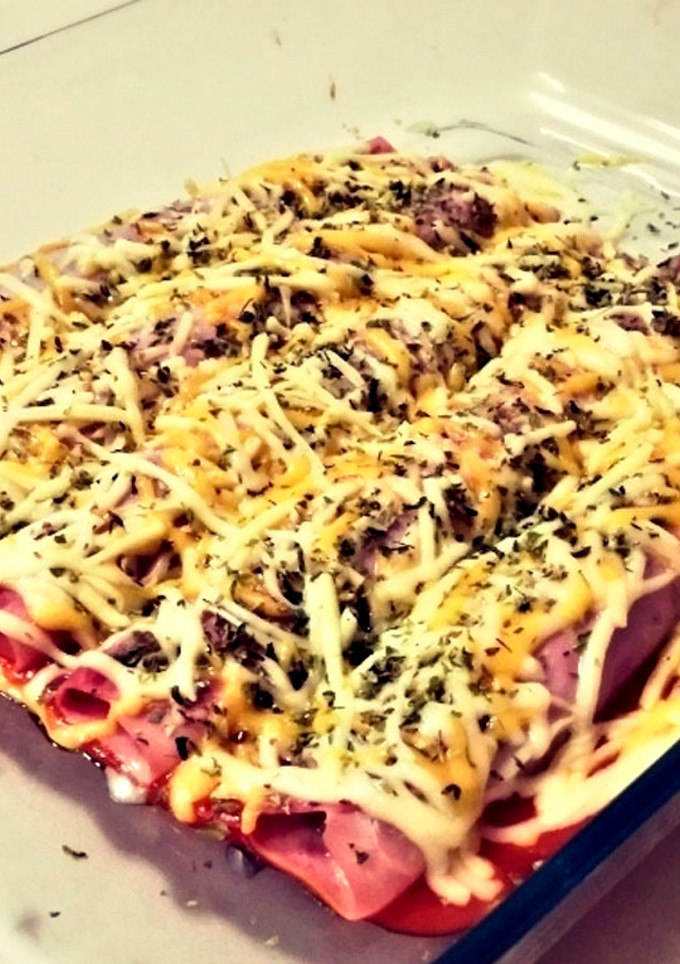 Una foto de Canelones de jamón york rellenos de verduras
