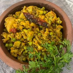 A picture of Aloo Fulgovi Matar Dry (Potato, cauliflower, Peas).