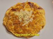 Una foto de patatas con mozzarella fundido