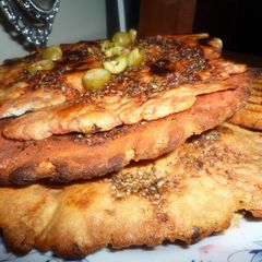 A picture of Manakish - Leham, Za'atar, Chili or Cheese.