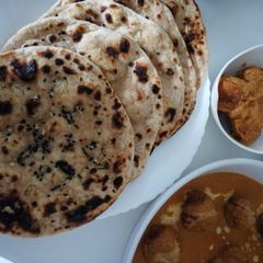A picture of Garlic tandoori roti on tava.