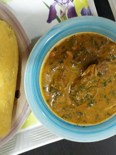 A picture of Ogbono soup with garri.