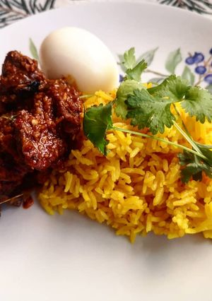 A picture of Tumeric Rice with spices.