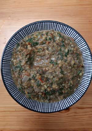 A picture of Green gram with spinach curry.