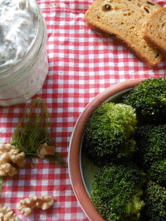A picture of Roasted broccoli with a side order of greek yogurt dip.