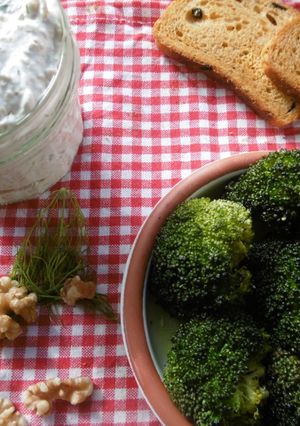A picture of Roasted broccoli with a side order of greek yogurt dip.