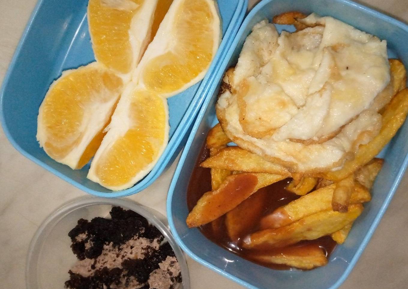French fries with fried egg and ketchup