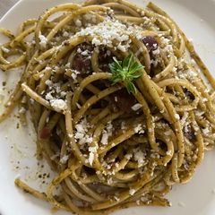 A picture of Spinach and olive pesto pasta.