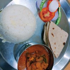 A picture of Fish curry and rice.