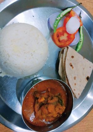 A picture of Fish curry and rice.
