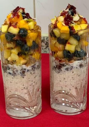 A picture of Overnight Soaked Oats and Soy Milk Parfait With 🥭 🍎 🥝 & black berries.