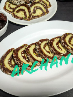 A picture of Dates mawa Swiss roll burfi.