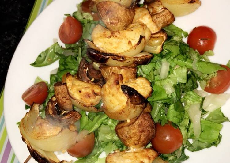 Healthy chicken skewers served with a salad