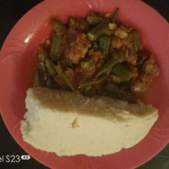 A picture of Ugali with Gizzard and Okra.